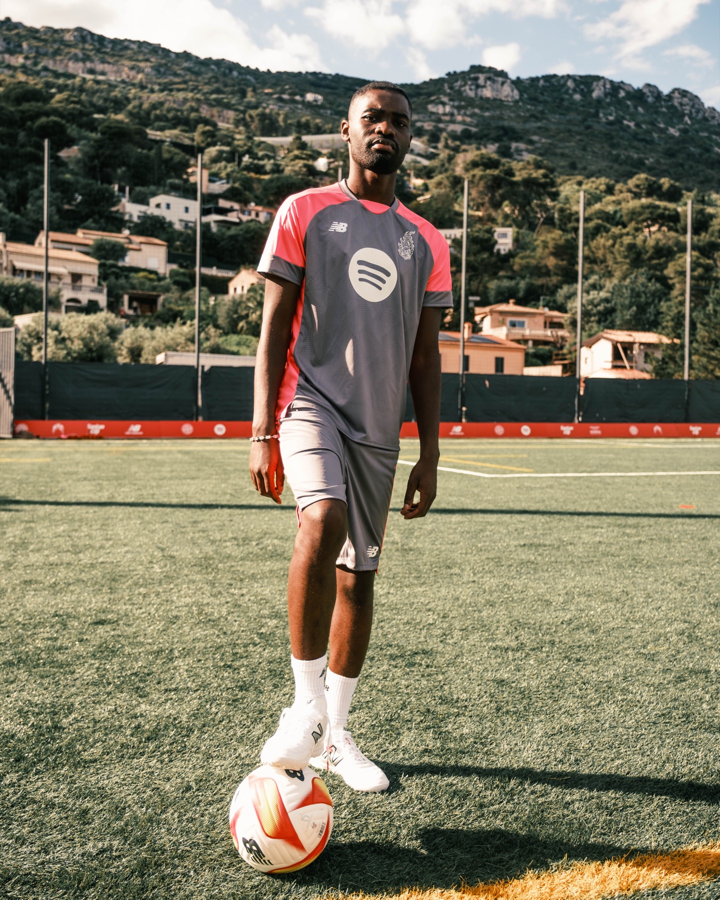 Footballer standing over the ball at Santan Cup.